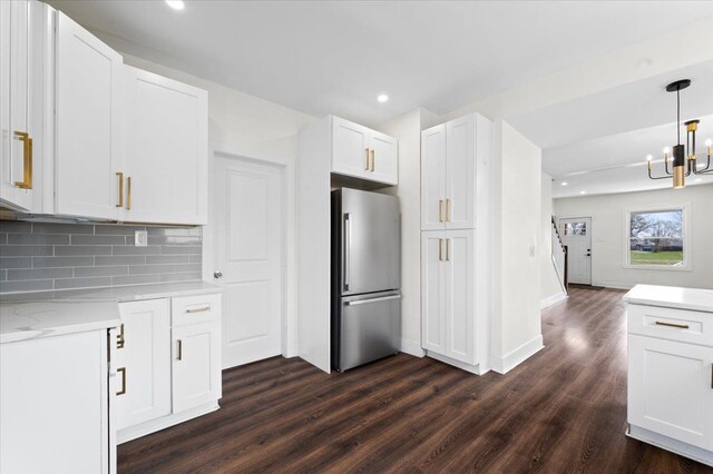 11393 Fisher Ave, Warren, MI 48089 - kitchen featuring dark wood finished floors, freestanding refrigerator, recessed lighting, a notable chandelier, and white cabinetry