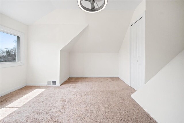 11393 Fisher Ave, Warren, MI 48089 - bonus room with baseboards, lofted ceiling, visible vents, and carpet