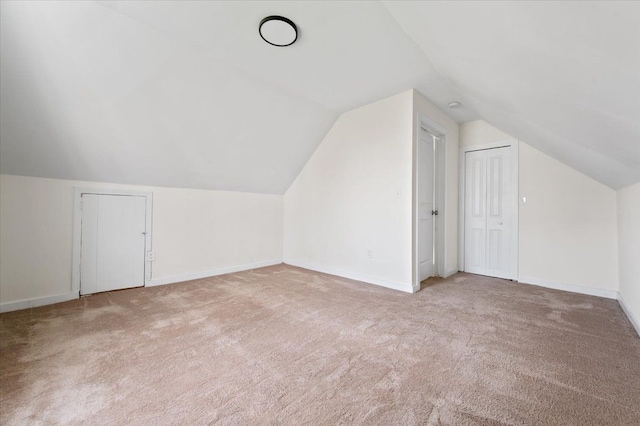 11393 Fisher Ave, Warren, MI 48089 - additional living space with vaulted ceiling, carpet flooring, and baseboards