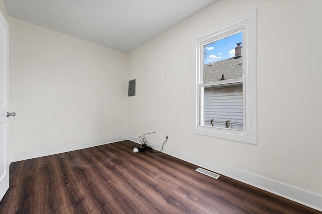 11393 Fisher Ave, Warren, MI 48089 - empty room featuring electric panel, baseboards, visible vents, and dark wood-type flooring
