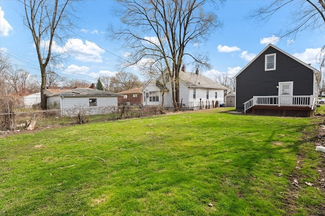 11393 Fisher Ave, Warren, MI 48089 - view of yard featuring an outbuilding, a shed, a fenced backyard, and a deck