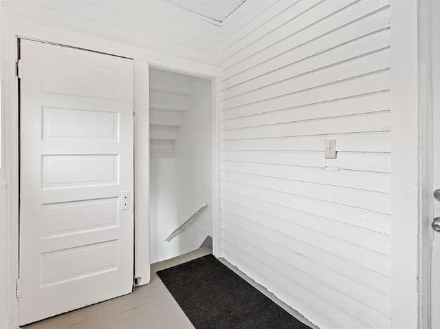 interior space featuring wood walls