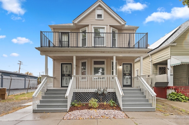 view of front of home with a porch and a balcony