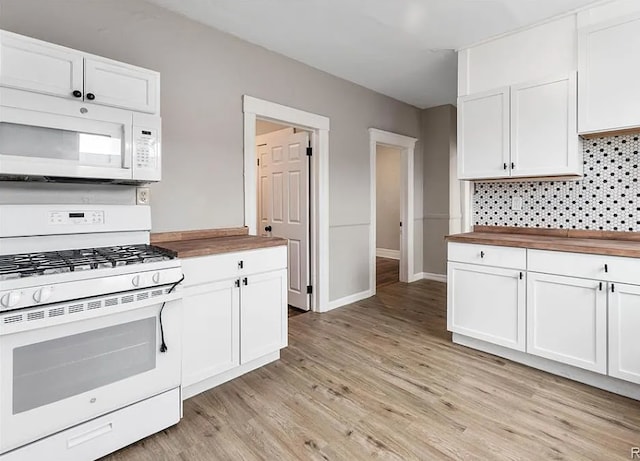 kitchen with white cabinets, white appliances, wood counters, light wood-style flooring, and decorative backsplash