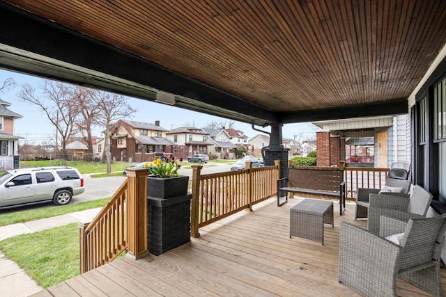 wooden terrace with a residential view