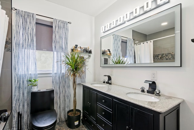 bathroom with double vanity, a sink, and a shower with curtain