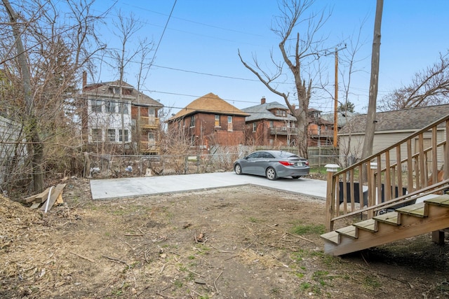 view of yard featuring a residential view and fence