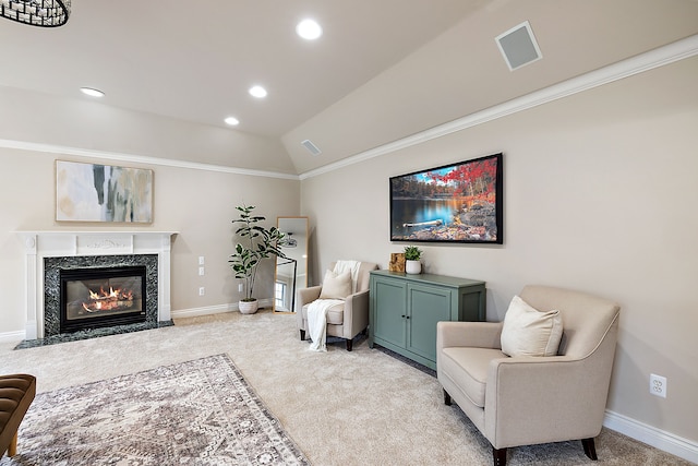 sitting room with light carpet, crown molding, baseboards, and vaulted ceiling