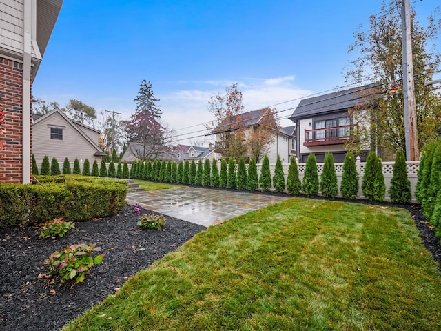 view of yard with a patio and fence