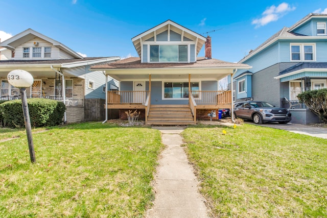 2533 Virginia Park St, Detroit, MI 48206 - bungalow-style home with a front lawn, covered porch, and a chimney