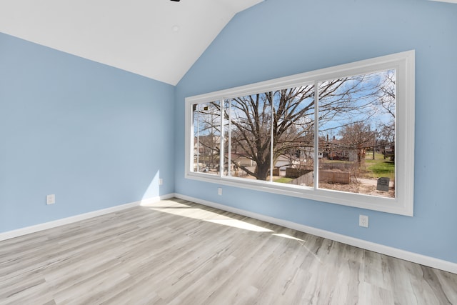2533 Virginia Park St, Detroit, MI 48206 - unfurnished room featuring baseboards, vaulted ceiling, plenty of natural light, and wood finished floors