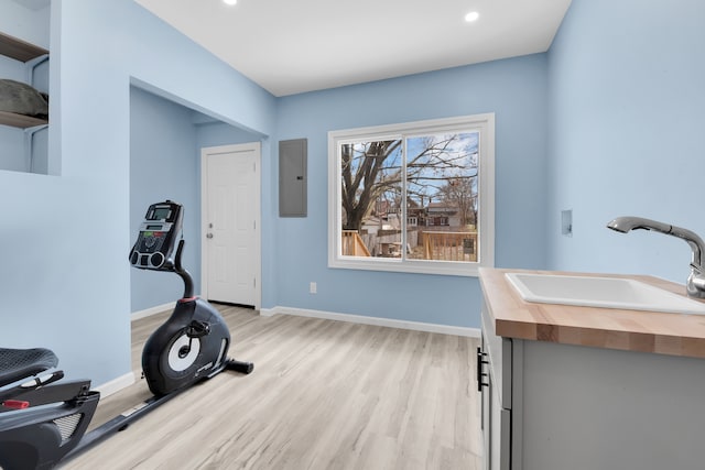 2533 Virginia Park St, Detroit, MI 48206 - exercise room featuring baseboards, light wood-type flooring, electric panel, recessed lighting, and a sink