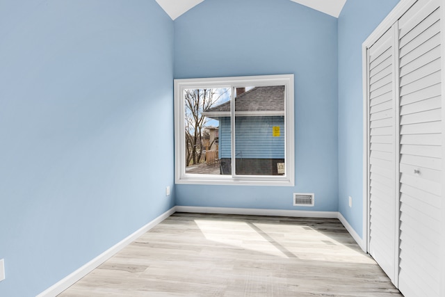 2533 Virginia Park St, Detroit, MI 48206 - unfurnished bedroom with visible vents, light wood-style flooring, a closet, and vaulted ceiling