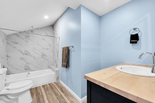 2533 Virginia Park St, Detroit, MI 48206 - bathroom with washtub / shower combination, baseboards, toilet, wood tiled floor, and vanity