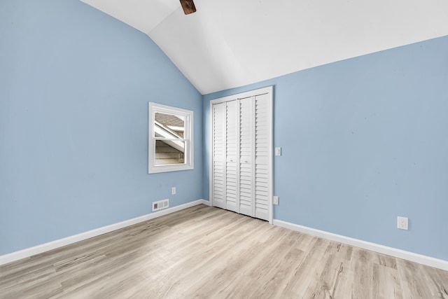 2533 Virginia Park St, Detroit, MI 48206 - unfurnished bedroom featuring a closet, visible vents, wood finished floors, lofted ceiling, and baseboards