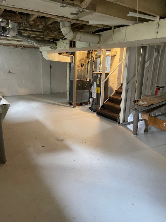 305 S Blvd W, Pontiac, MI 48341 - unfinished basement featuring water heater and stairs