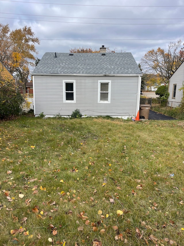 305 S Blvd W, Pontiac, MI 48341 - back of property with a chimney and a shingled roof