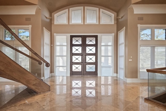 82 Chateaux Du Lac, Fenton, MI 48430 - foyer entrance featuring high vaulted ceiling, french doors, and marble finish floor