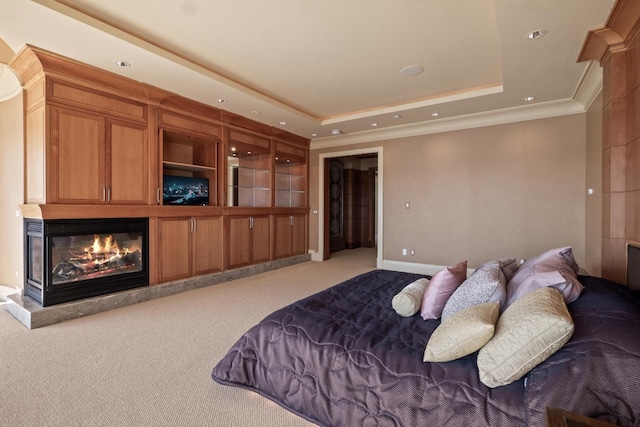 82 Chateaux Du Lac, Fenton, MI 48430 - carpeted bedroom featuring a raised ceiling, baseboards, a glass covered fireplace, ornamental molding, and recessed lighting