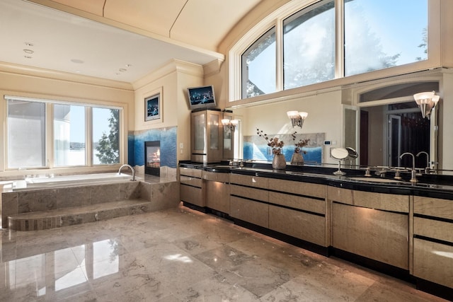 82 Chateaux Du Lac, Fenton, MI 48430 - bathroom featuring vanity, ornamental molding, a glass covered fireplace, and a bath