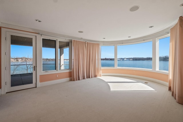 82 Chateaux Du Lac, Fenton, MI 48430 - carpeted empty room featuring baseboards, recessed lighting, and a water view