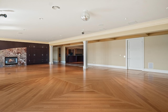 82 Chateaux Du Lac, Fenton, MI 48430 - unfurnished living room with crown molding, baseboards, a fireplace, and visible vents