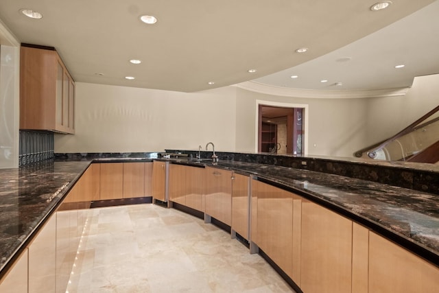 82 Chateaux Du Lac, Fenton, MI 48430 - kitchen with modern cabinets, dark stone counters, ornamental molding, recessed lighting, and light brown cabinets