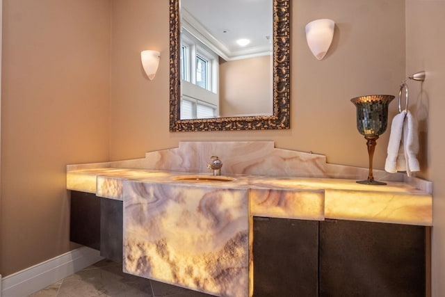 82 Chateaux Du Lac, Fenton, MI 48430 - bathroom with crown molding, baseboards, and vanity