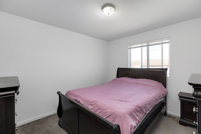 carpeted bedroom with baseboards