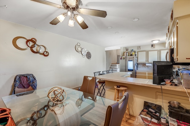 29190 Heritage, Southfield, MI 48076 - dining space with light wood-type flooring, stairway, and ceiling fan