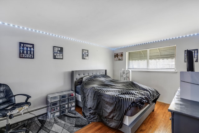 29190 Heritage, Southfield, MI 48076 - bedroom with baseboard heating and wood finished floors