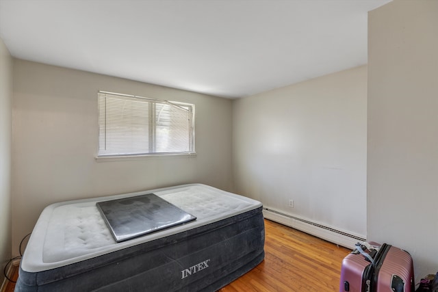 29190 Heritage, Southfield, MI 48076 - bedroom with baseboard heating and wood finished floors