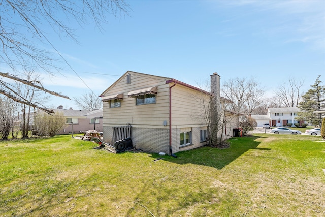 29190 Heritage, Southfield, MI 48076 - view of side of property featuring a lawn, a chimney, and brick siding