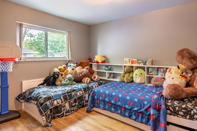 bedroom with wood finished floors
