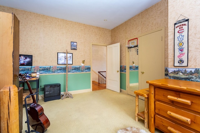 carpeted bedroom with wallpapered walls