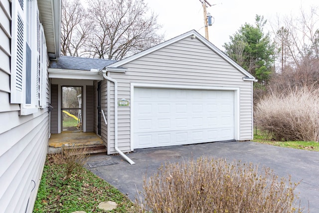 garage featuring driveway