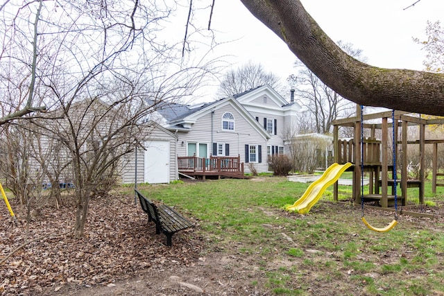 view of jungle gym featuring a deck and a yard