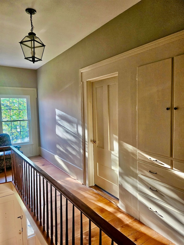 stairway with wood finished floors