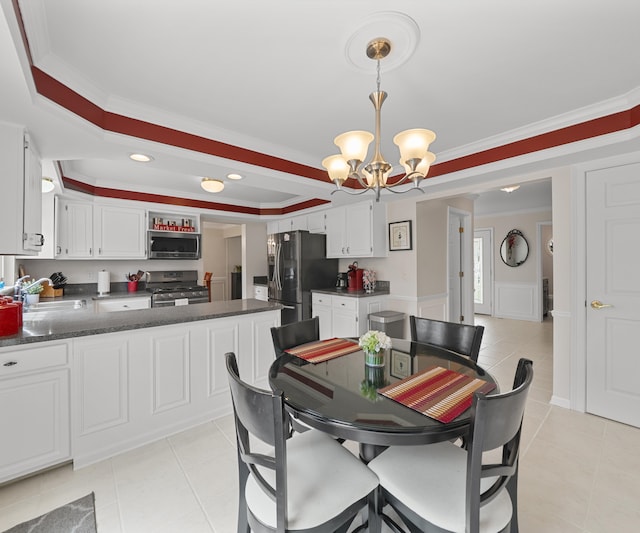 dining space featuring crown molding, light tile patterned floors, a wainscoted wall, a chandelier, and recessed lighting