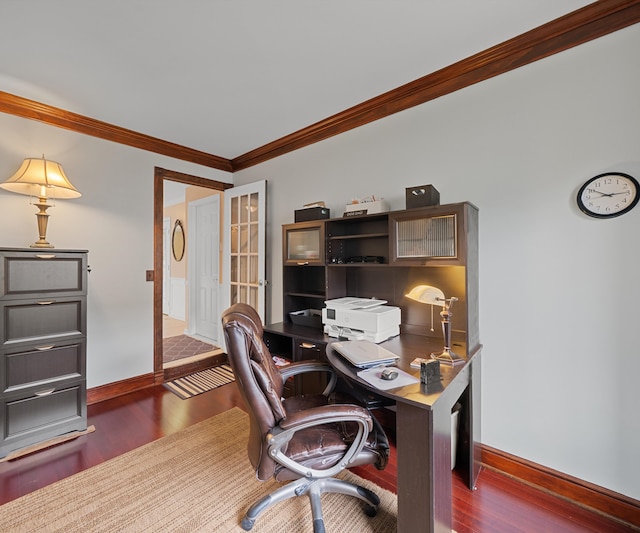 office space featuring baseboards, ornamental molding, and wood finished floors