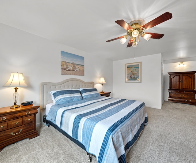 bedroom with baseboards, light colored carpet, and ceiling fan