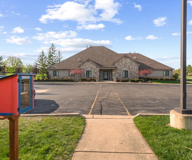 view of property with uncovered parking