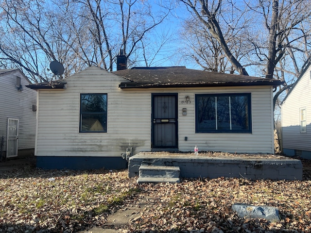19763 Gilchrist St, Detroit, MI 48235 - bungalow-style house with roof with shingles and a chimney