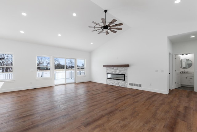 unfurnished living room with visible vents, a stone fireplace, a ceiling fan, and recessed lighting