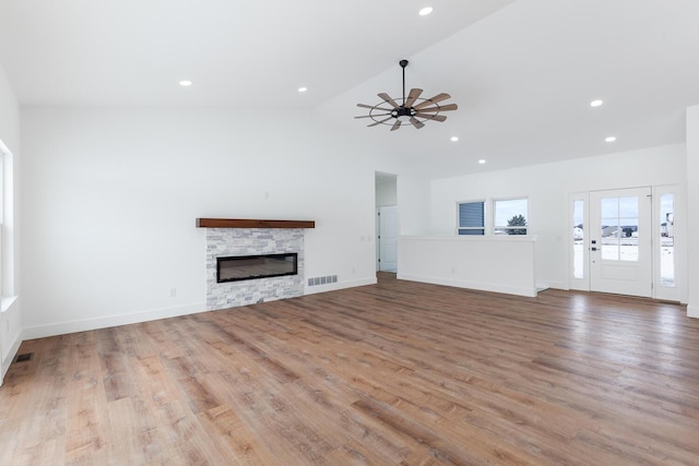 unfurnished living room featuring recessed lighting, a fireplace, visible vents, ceiling fan, and wood finished floors