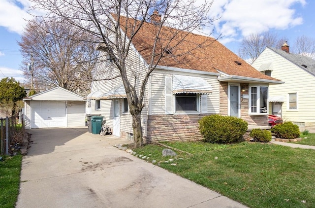 view of front of house with an outbuilding, a front lawn, a chimney, a garage, and concrete driveway