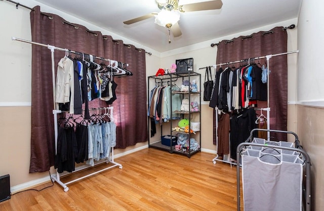 spacious closet with a ceiling fan and wood finished floors