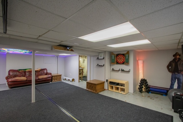 finished basement with a paneled ceiling