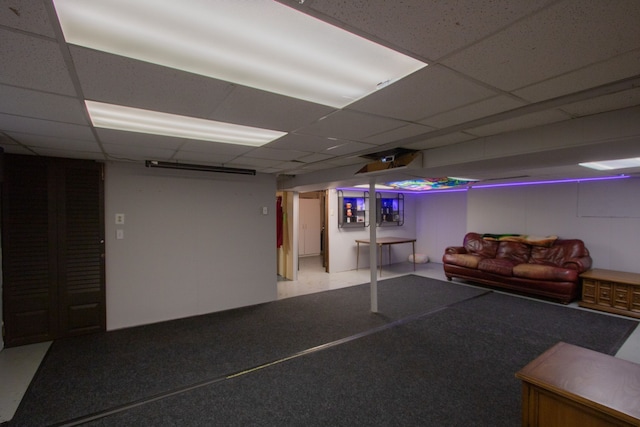 finished basement with a paneled ceiling