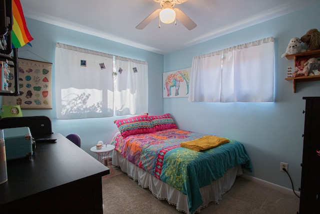 carpeted bedroom with a ceiling fan